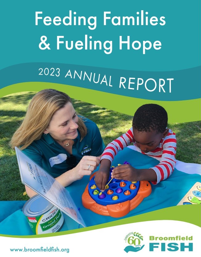 The front cover of the 2023 Broomfield FISH Annual Report showing a FISH volunteer helping a child play a board game at a community event.